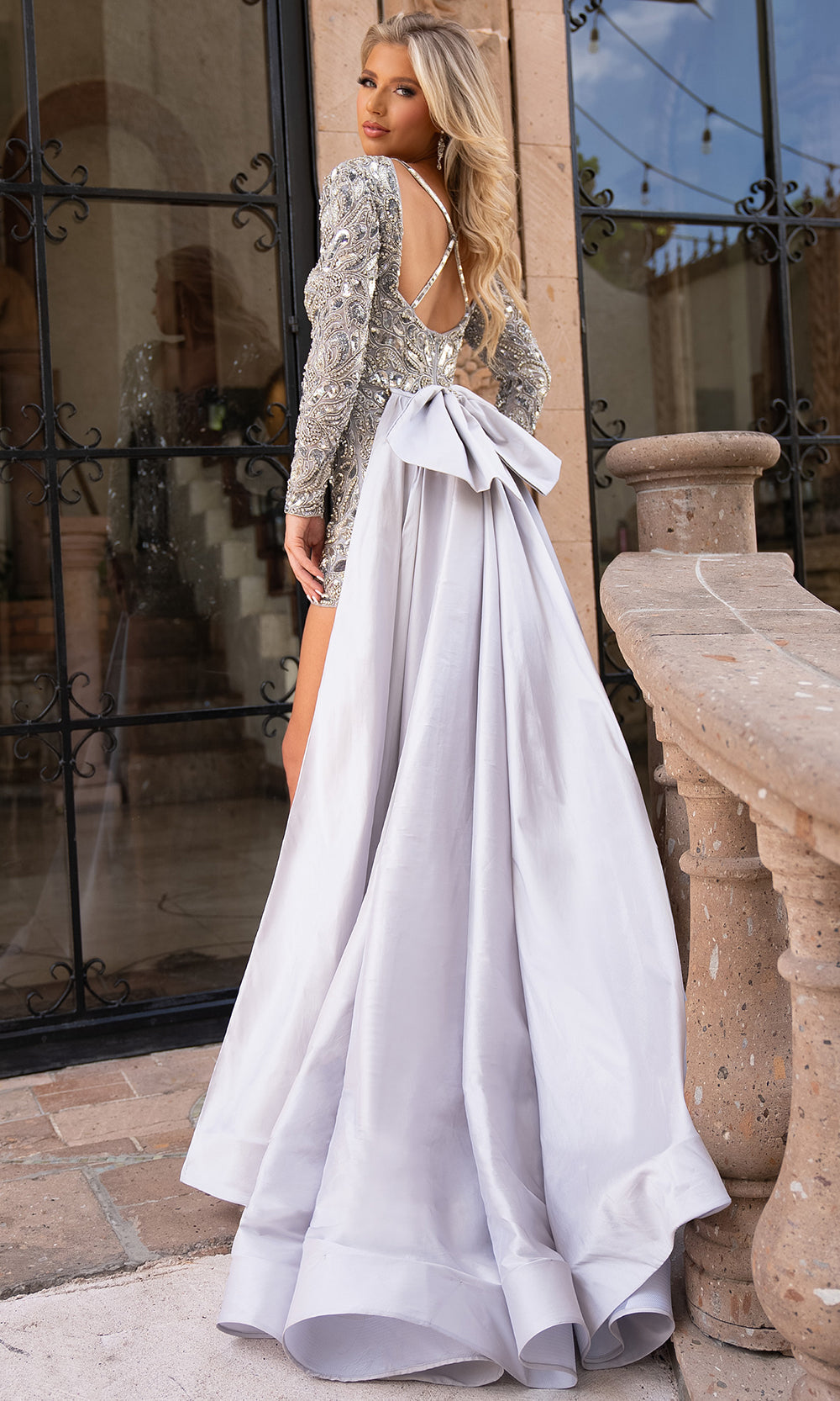 Rachel Allan 50311 - Short Stretch Tulle, Beading, Taffeta, Stone Beading Romper - Sheer Long Sleeves, Fitted Bodice, Crisscross Strap, Back Zipper Closure, Bow Detailed, Over Skirt ADASA Rachel Allan 50311 - Short Stretch Tulle, Beading, Taffeta, Stone Beading Romper - Sheer Long Sleeves, Fitted Bodice, Crisscross Strap, Back Zipper Closure, Bow Detailed, Over Skirt ADASA