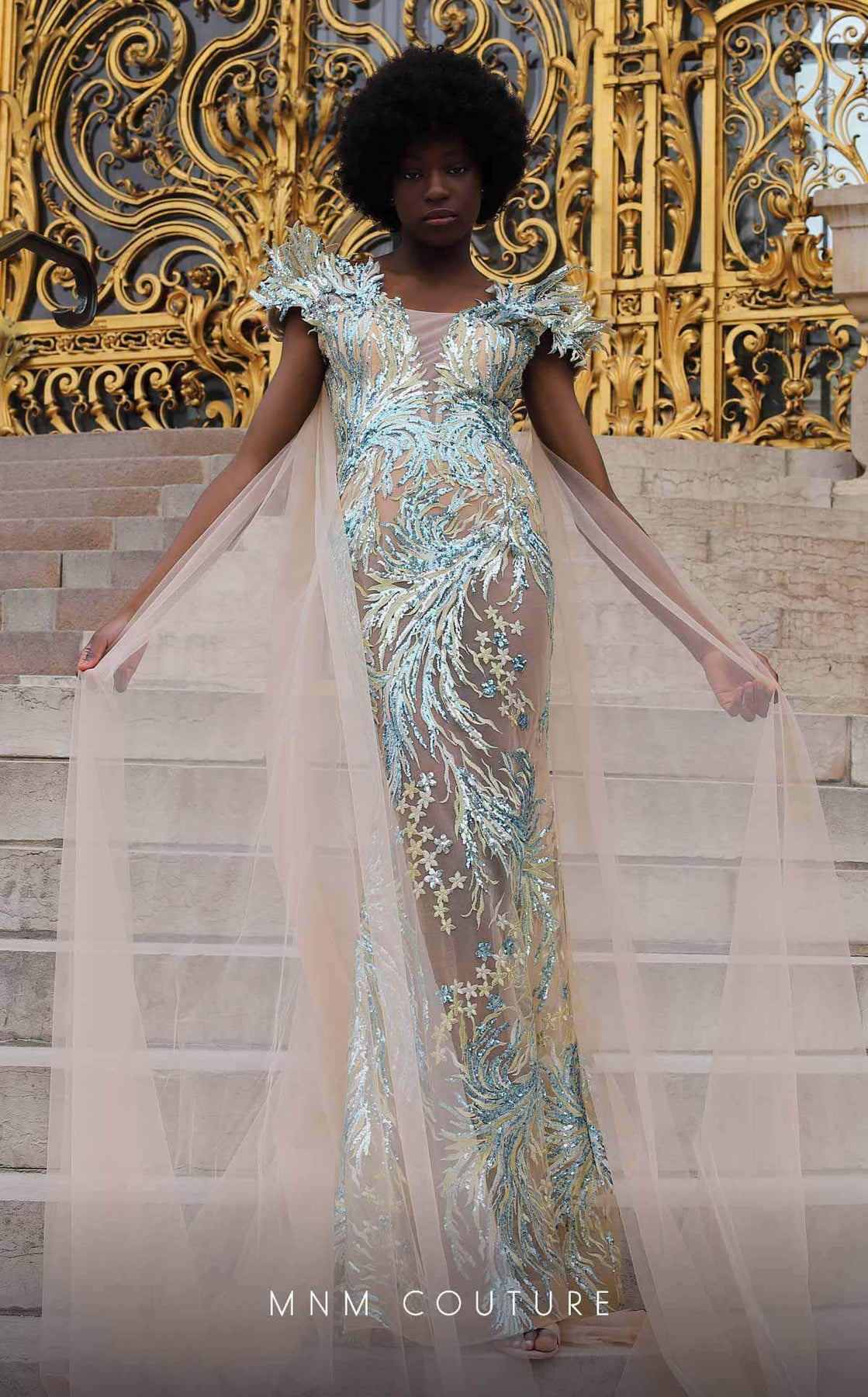 MNM Couture K4070 - Long Mermaid Dress - Metallic applique, Sheer, Embellished sleeves, Shoulder drape tail, V back, Center back zipper closure, Horsehair hem ADASA MNM Couture K4070 - Long Mermaid Dress - Metallic applique, Sheer, Embellished sleeves, Shoulder drape tail, V back, Center back zipper closure, Horsehair hem ADASA