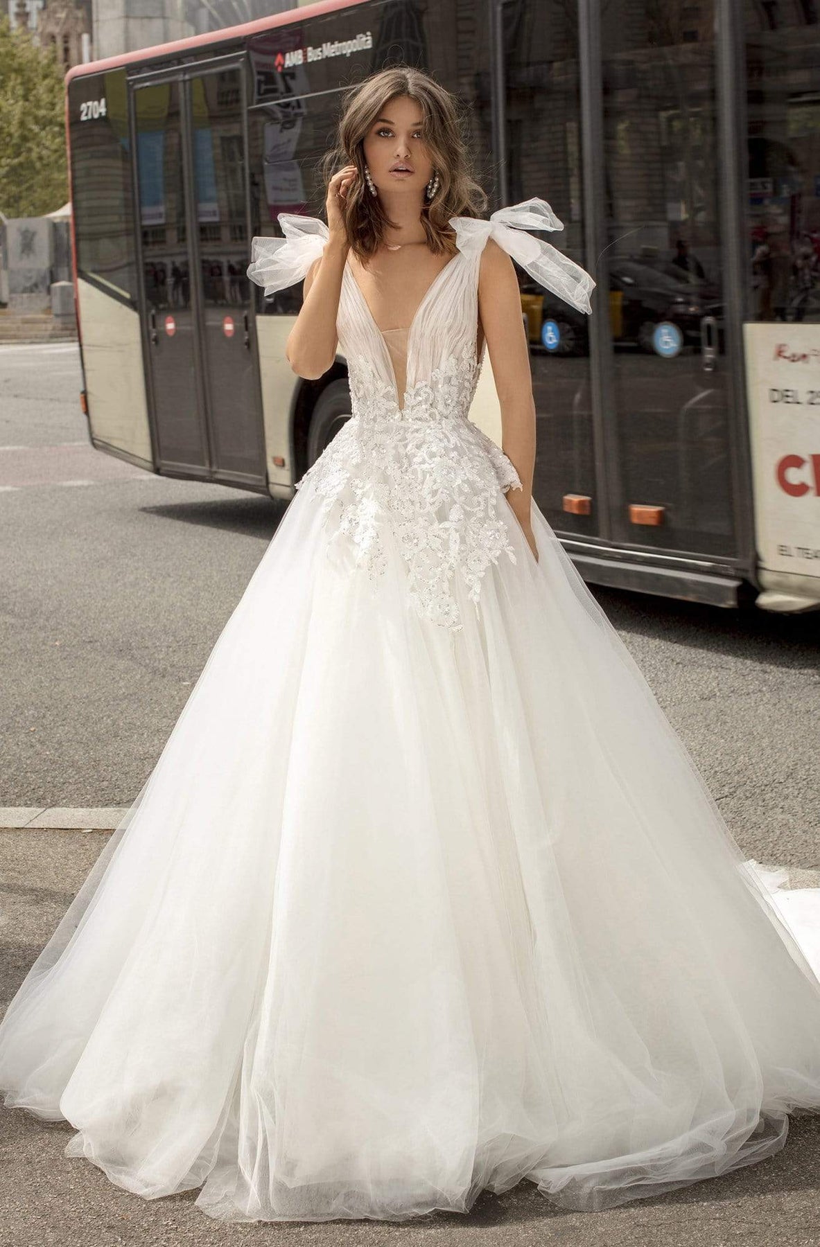 LAIA is a stylish long sleeved ivory wedding dress with a chiffon skirt and  sparkle embellishment